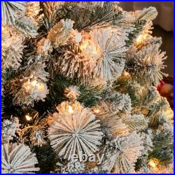 9 ft Prelit Flocked Artificial Christmas Tree with 750 Clear Lights