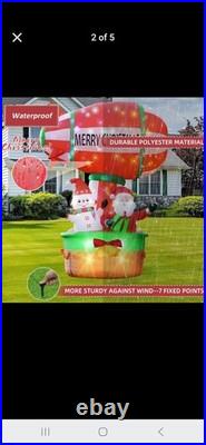 9ft tall hot air balloon blimp carrying santa and snow man. Twinkling lights