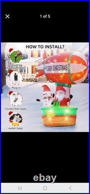 9ft tall hot air balloon blimp carrying santa and snow man. Twinkling lights