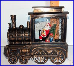 Gerson Santa and Snowman Riding in Trains Lighted Musical Water Globe Set of 2