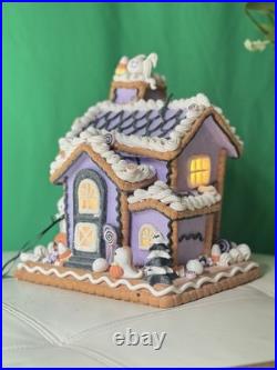 Ghoulish 12 Purple Haunted Gingerbread House LED Light-Up with Ghosts & Pumpkins
