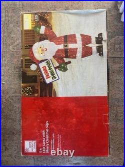 Home Accents Holiday 5 Ft. LED Santa With Merry Christmas & Sign Outside Deco