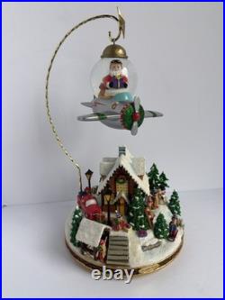 Santa's Fly by Snowglobe by Christopher Radko Christmas Music Box Airplane