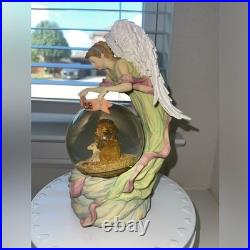 Vintage Silvestri Musical Snow Globe withAngel Watching Over- Plays Silver bells